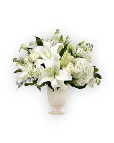 A stunning bouquet is a thoughtful way to send your condolences during difficult times. Each bouquet is handcrafted with lilies, hydrangeas and lisianthus to share your sympathy. While the lilies may initially arrive in bud form, they transform into bursting flowers as they open.