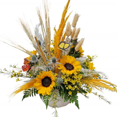 A stunning and vibrant bouquet. The combination of bright yellow mini sunflowers and wax flowers creates a cheerful and warm atmosphere. The addition of blue thistle adds a beautiful contrast, while the preserved florals like wheat, bunny tails, and pampas grass bring a touch of natural elegance and texture. The butterflies are a delightful finishing touch, offering a whimsical and enchanting element. This bouquet would be perfect for brightening up any space or for a special occasion!