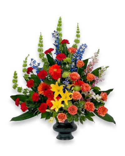 <p>A combination of bright color blooms to celebrate the life of your loved one.</p>