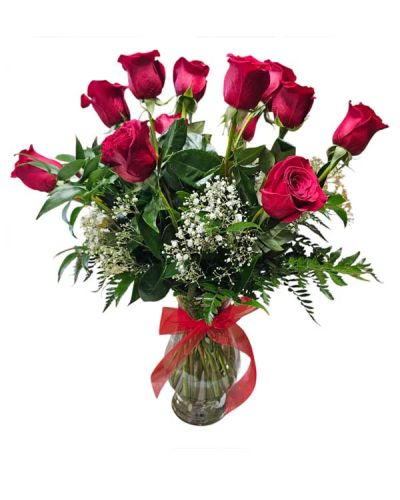 <p>Surprise your special one with this gorgeous arrangement of our premium red roses available in one, two or three dozen. It's an unforgettable display of our long stem freedom red roses along with designer choice of assorted greenery. This is our most requested item.</p>