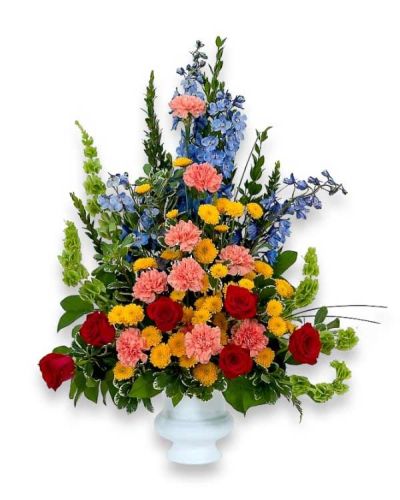 <p>A bright array of flowers combines to make a beautiful tribute.</p>