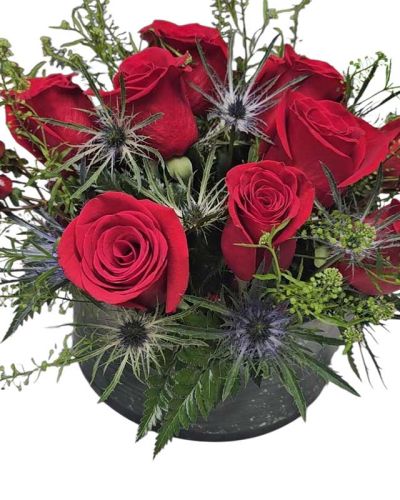 <p>A pave design of 1 dozen red roses perfect for your table at Berns Steakhouse or any restaurant of choice. This item is custom made and will vary each time since we custom make each one when order is placed. This is a guide to what we can offer for berns steakhouse reservations.</p>